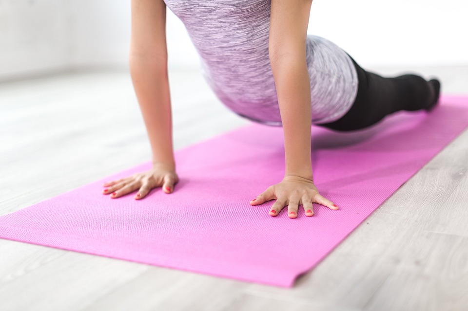 girl exercising on a mat