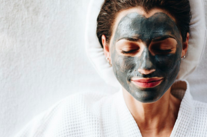 woman lying down with face mask on